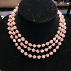 Shimmering rose colored beaded necklace